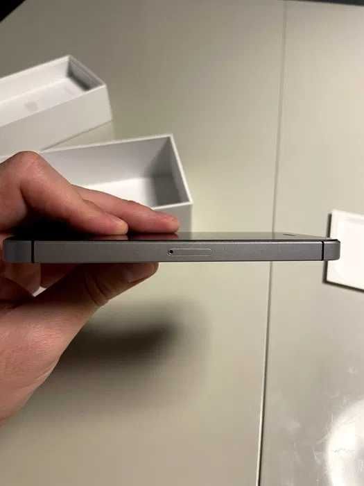 iPhone 5 SE with case and box