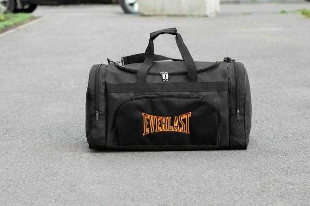 Чоловіча дорожна сумка EVERLAST Orange спортивна чорна на 60л