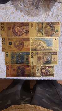 Позолочені банкноти Польши та Кувейту.