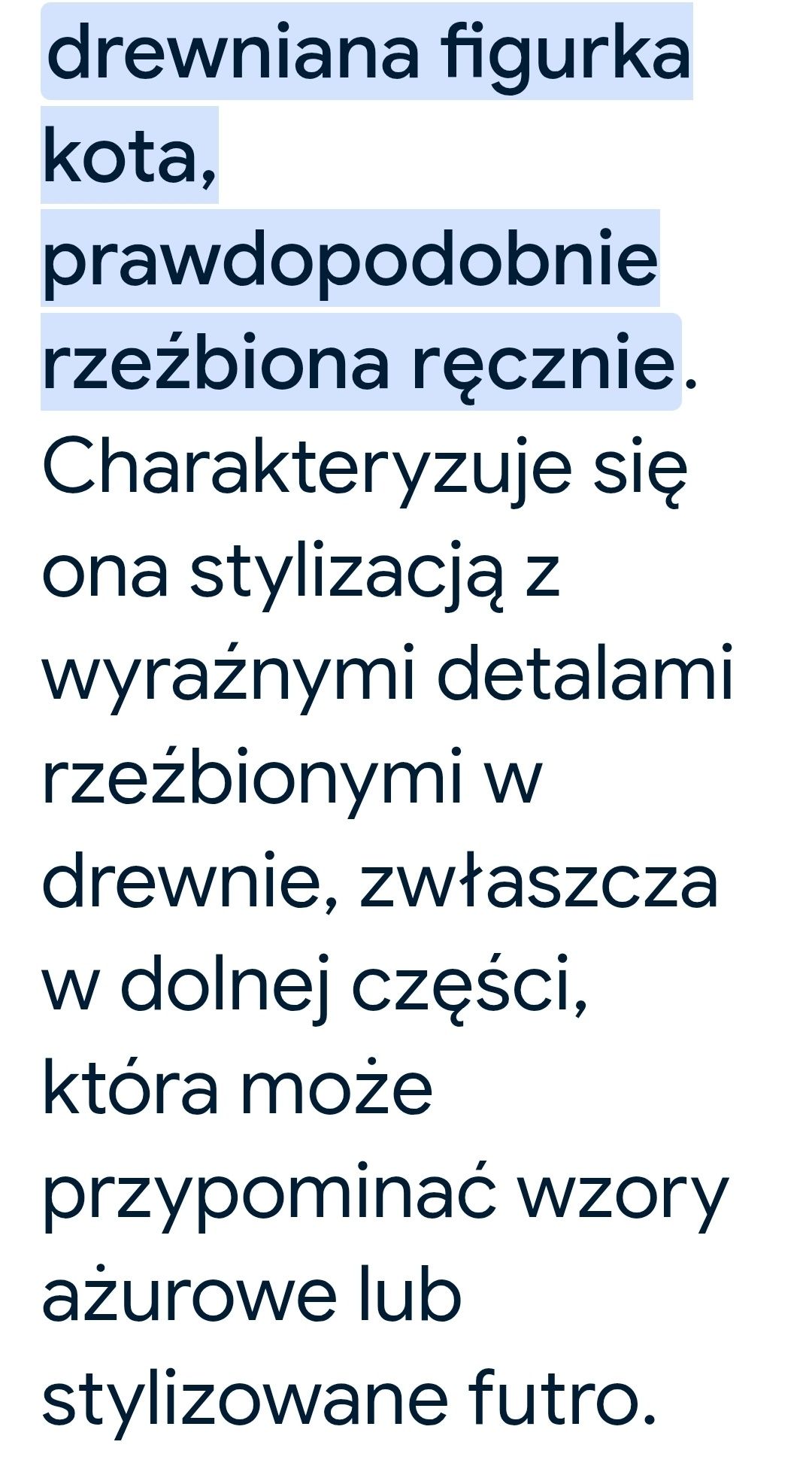 Figurka kota z drewna.
