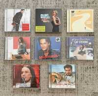 Conjunto de 8 CDs de música.