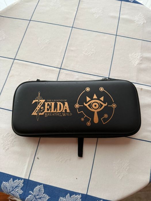 Nintendo switch + jogo + bolsas + película + cartão de memoria