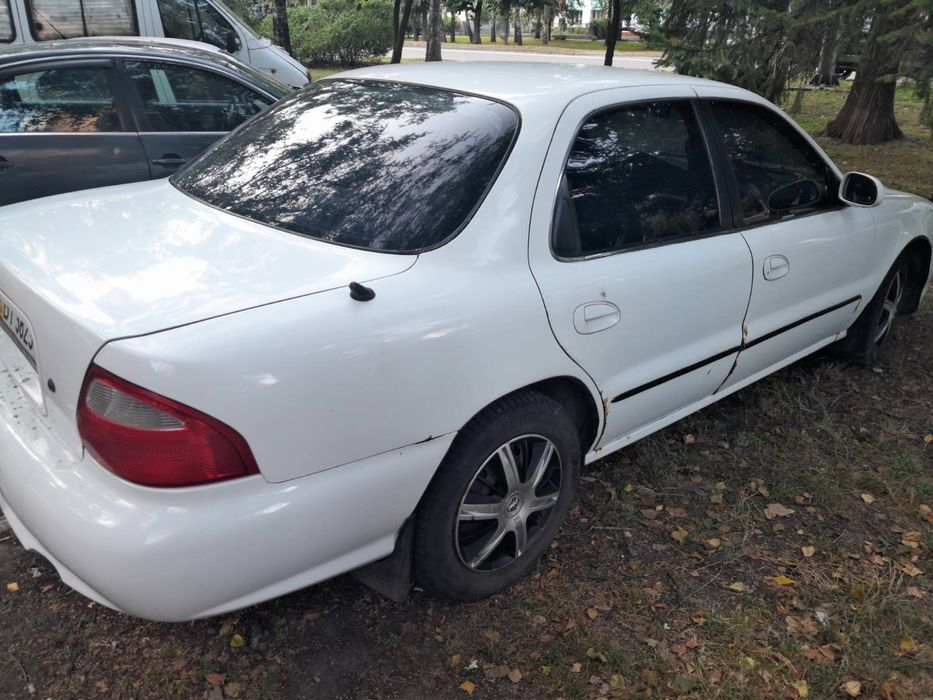 Кіа Кларус 2000 рік 2.0 газ/бензин ціна за двигун частинами