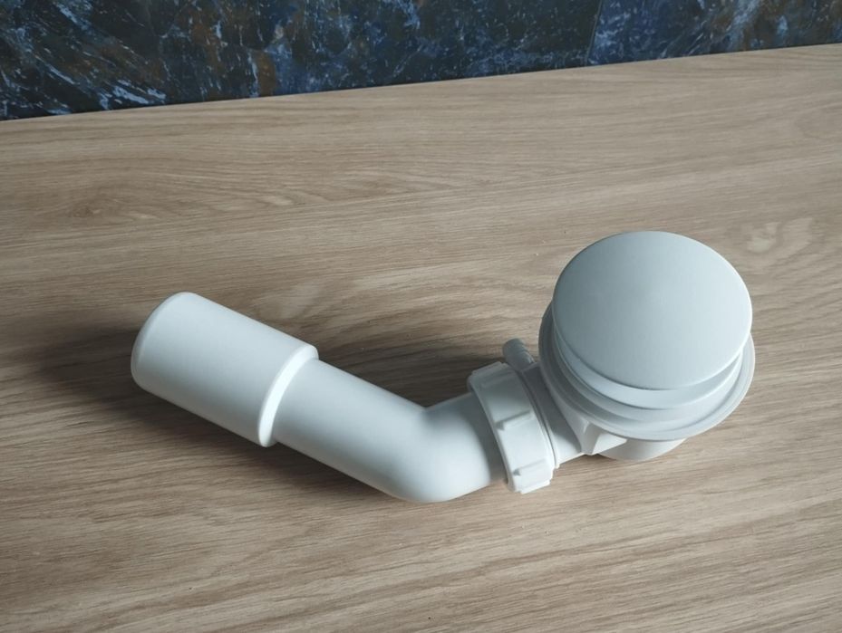 Nowy syfon do wanny firmy Cersanit z korkiem klik