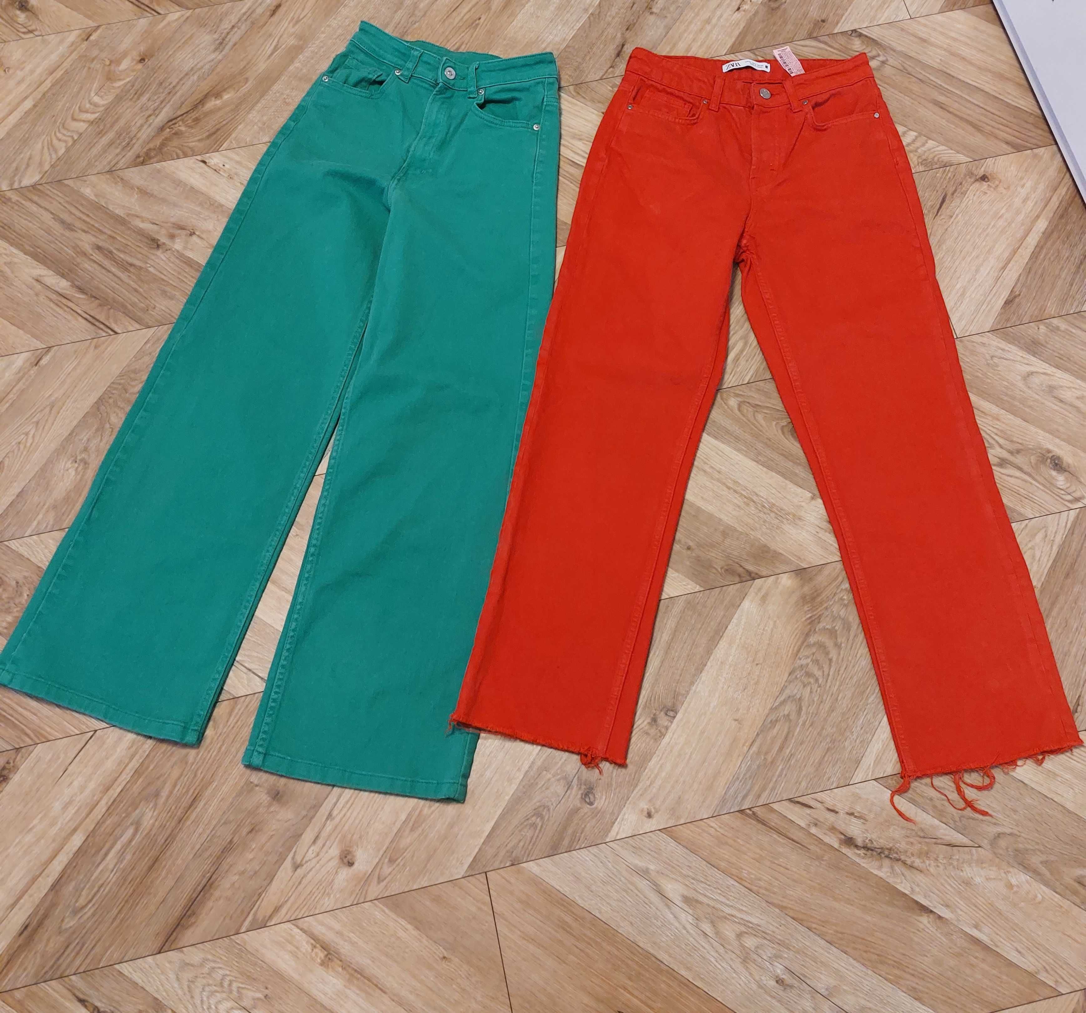 Dwie pary firmowych jeansów czerwone Zara i zielone H&M