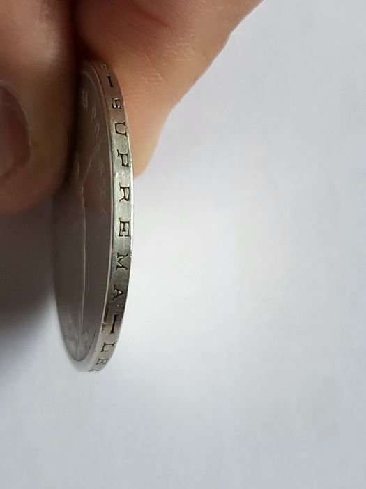 Srebrna moneta Nike 1928 TYP A ze znakiem mennicy.