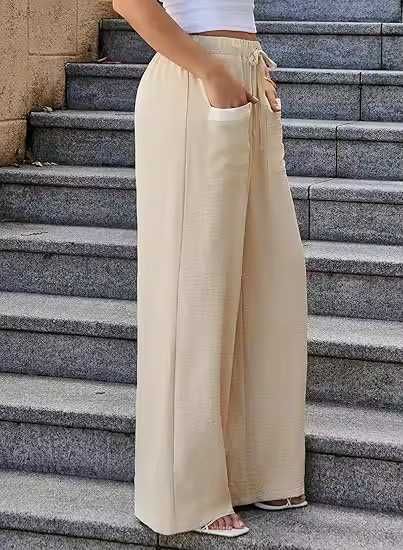 ... палацо брюки с широкими штанинами и контрастными карманами