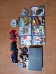 PlayStation 2, com jogos e e 3 comandos