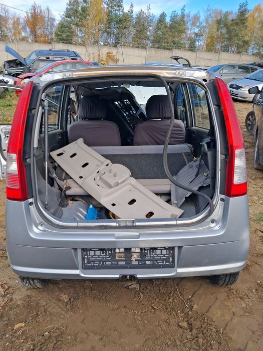 Daihatsu cuore 03 zderzak tylni E28