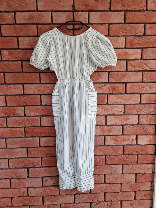 Piękny biały kombinezon w paski Primark r 146