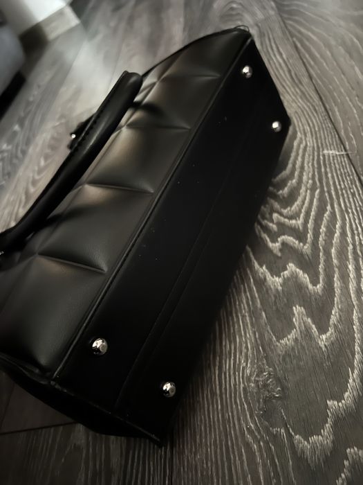 Шкіряна сумка.