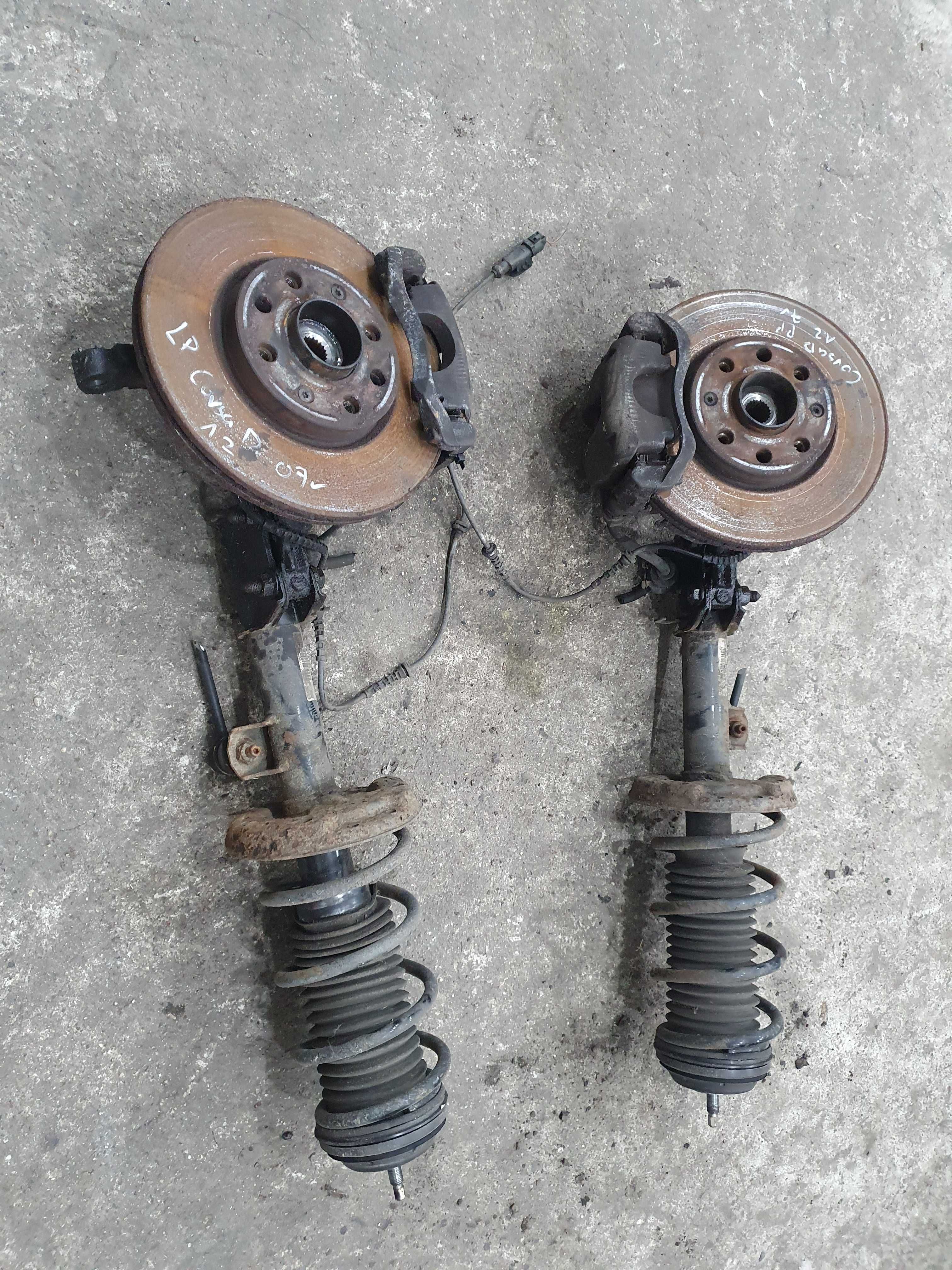Amortyzator piasta zwrotnica zacisk sprezyna Opel Corsa D 1.2