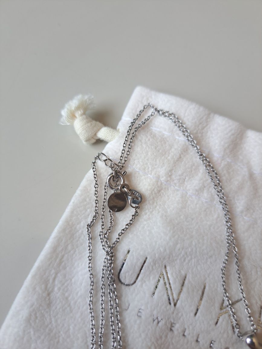 Colar Unike Jewellery - Prata 925, Pérola e Cristais
- Prata 925.
- Pi