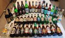 42 garrafas de cerveja com carica de várias marcas e países