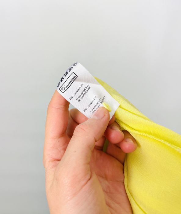 Cytrynowa bluzka z transparentnego materiału i szerokimi rękawami L 40