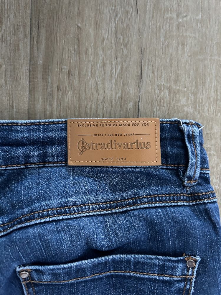 Spodnie jeansy XS 34 Stradivarius duże dziury ZIP Zamki