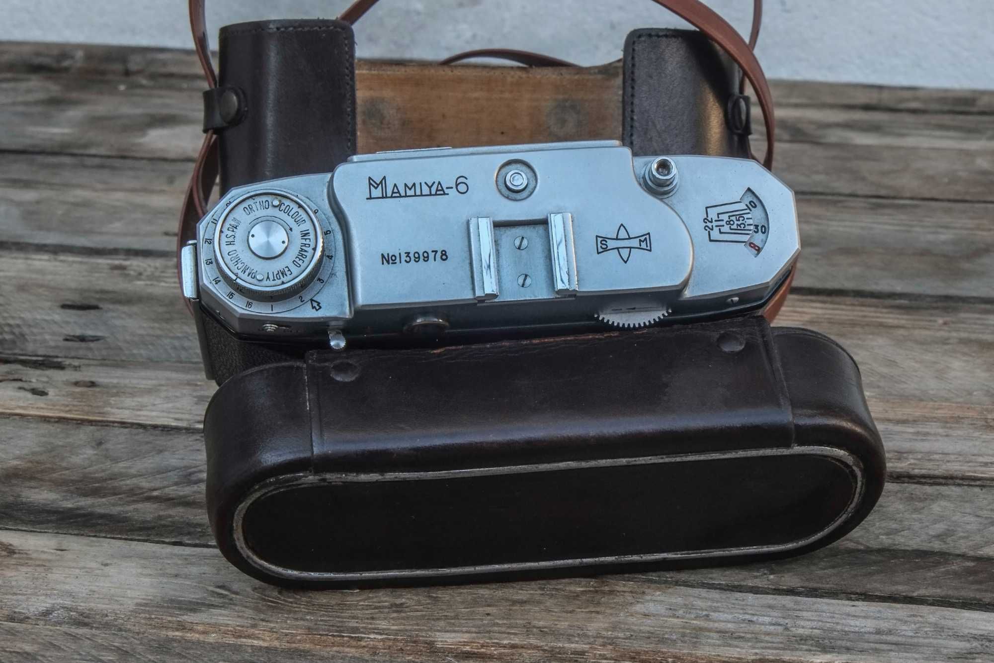 Mamiya 6 c/obj. Zuiko 75mm f:3.5 com telémetro dos anos 50.