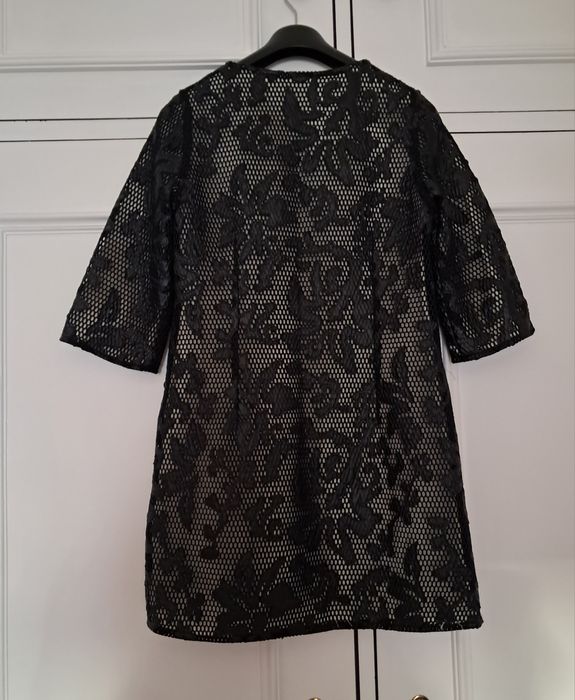 Casaco preto arrendado