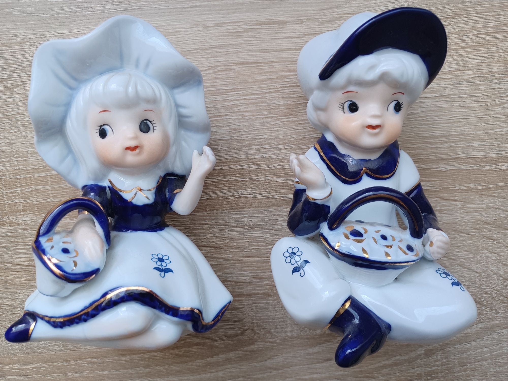 Figurki chłopca i dziewczynki z porcelany
