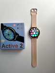 Złoty smartwatch beżowy pasek