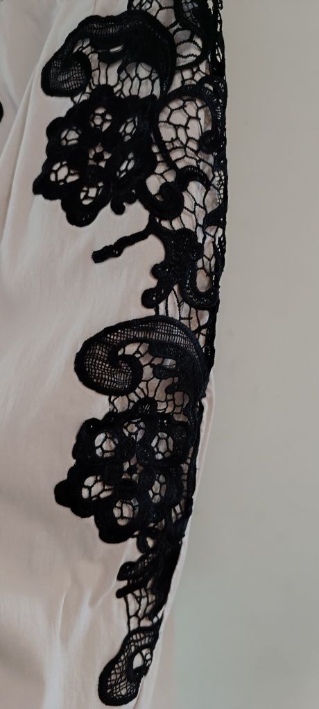 Elegancka dopasowana sukienka 38