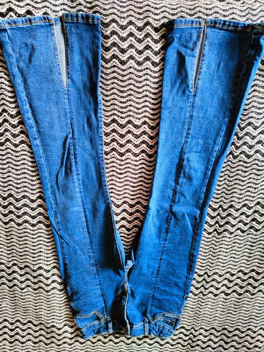 Jeansy dziewczęce z rozszerzoną nogawką Reserved 152 cm