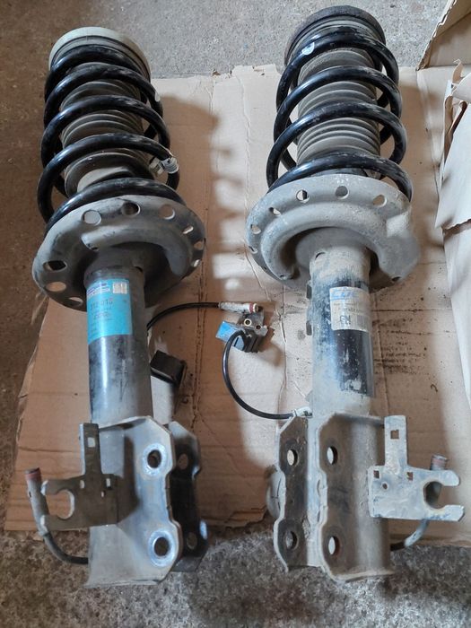 Передні стойки opel astra н gtc