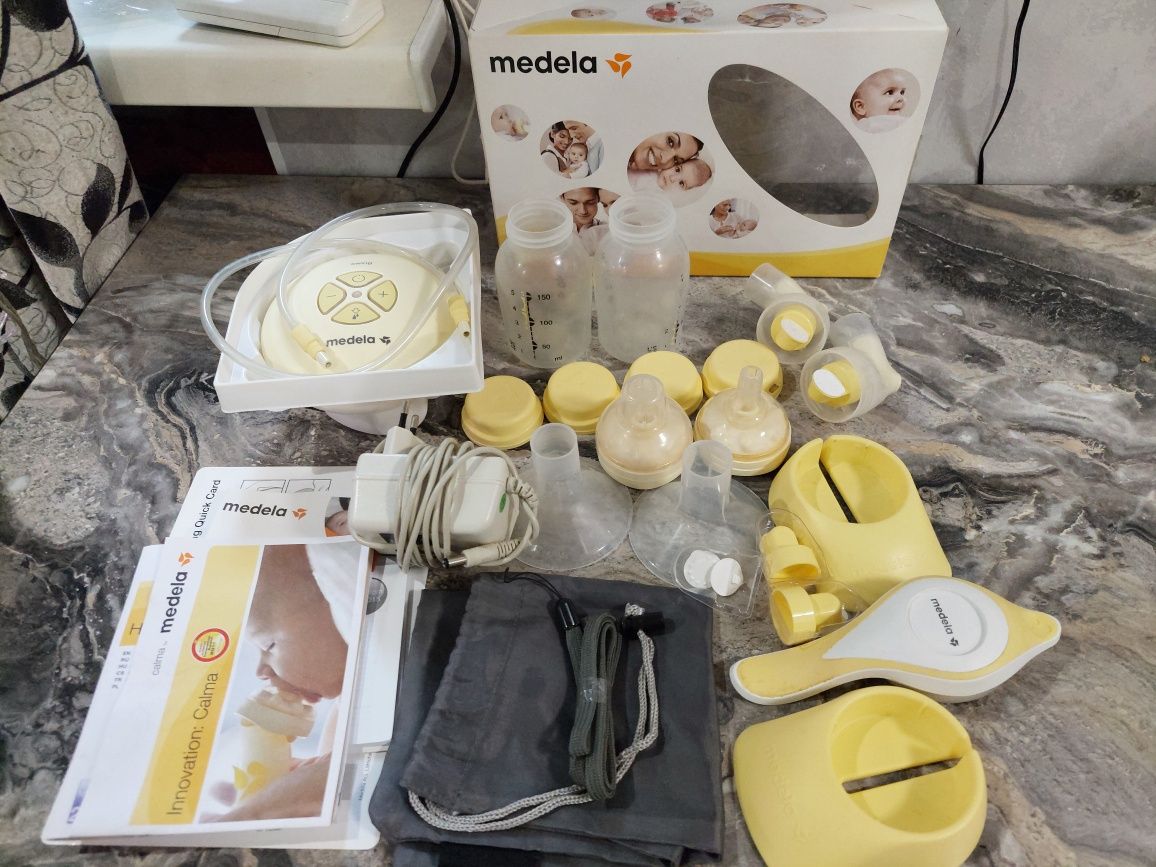 Молокоотсос Medela электро и ручной