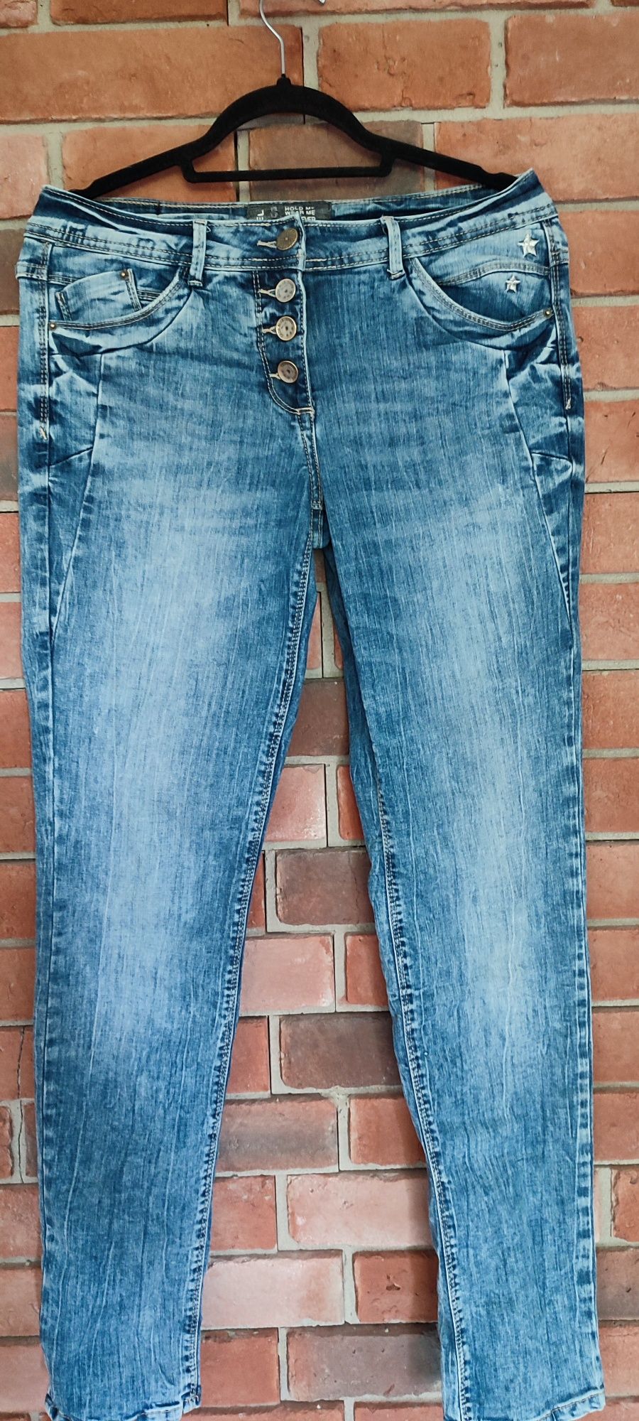Damskie spodnie jeansowe roz M
