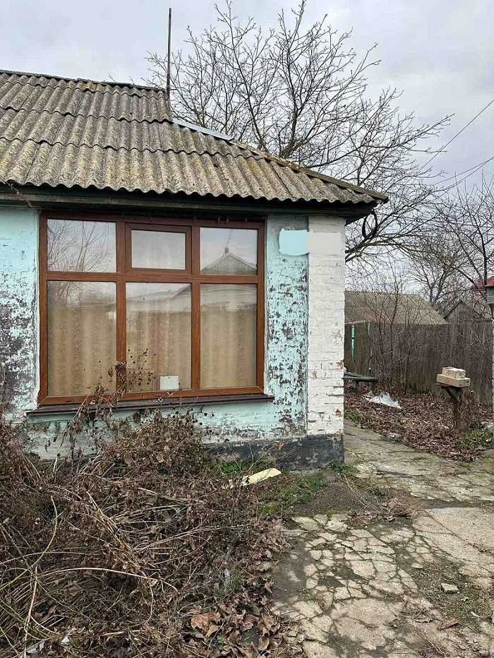 Пів будинку в центрі Баришівки