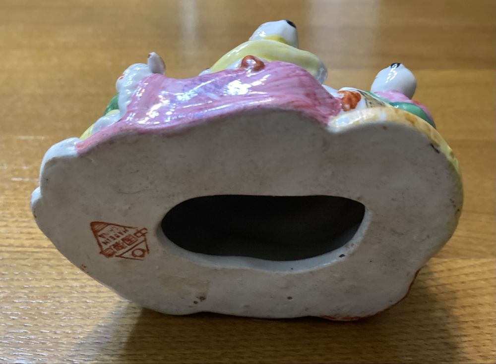 Buda da fertilidade em porcelana