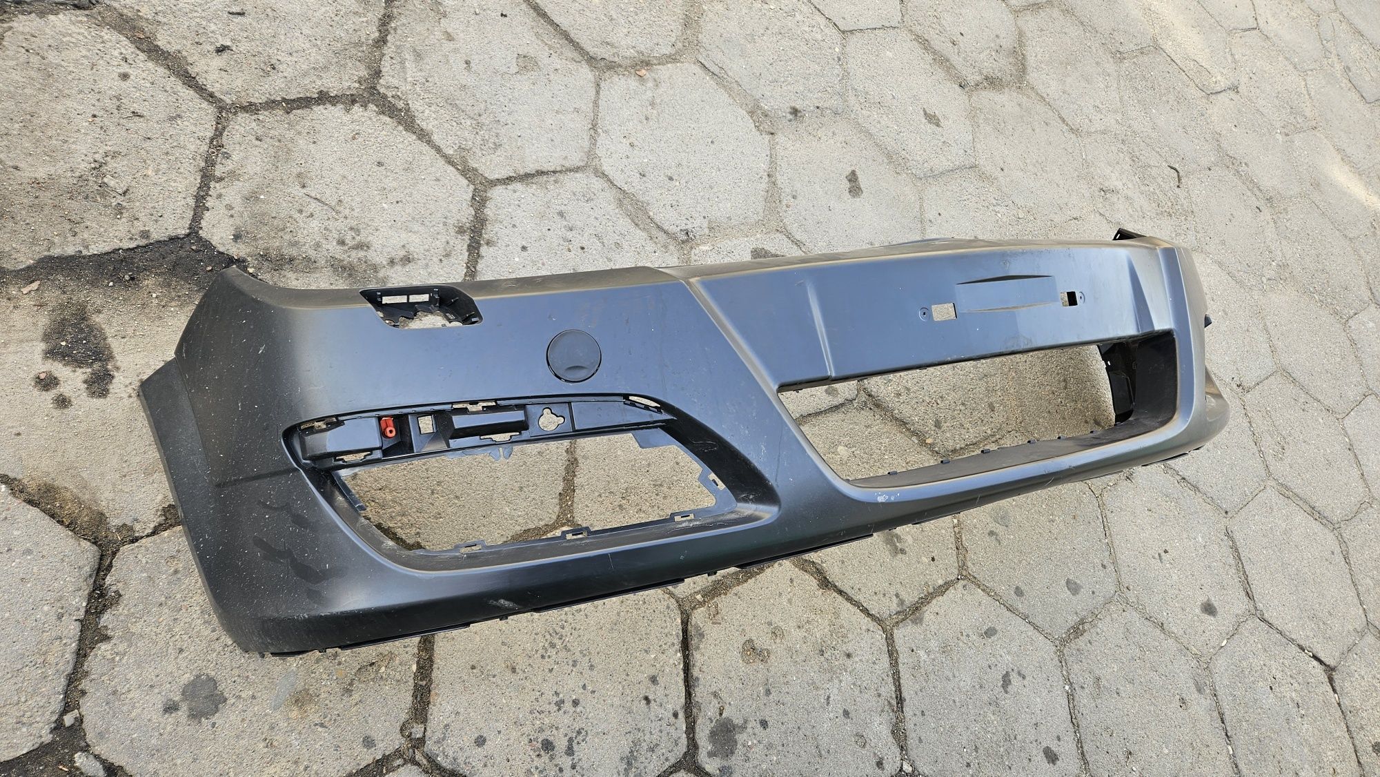 Nowy zderzak przód przedni opel astra h pod spryskiwacze reflektorów