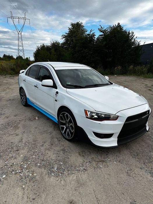 Mitsubishi Lancer Mitsubishi Lancer 1.8 Benzyna 2009 • EVO Style • Zadbany • Gotowy do j