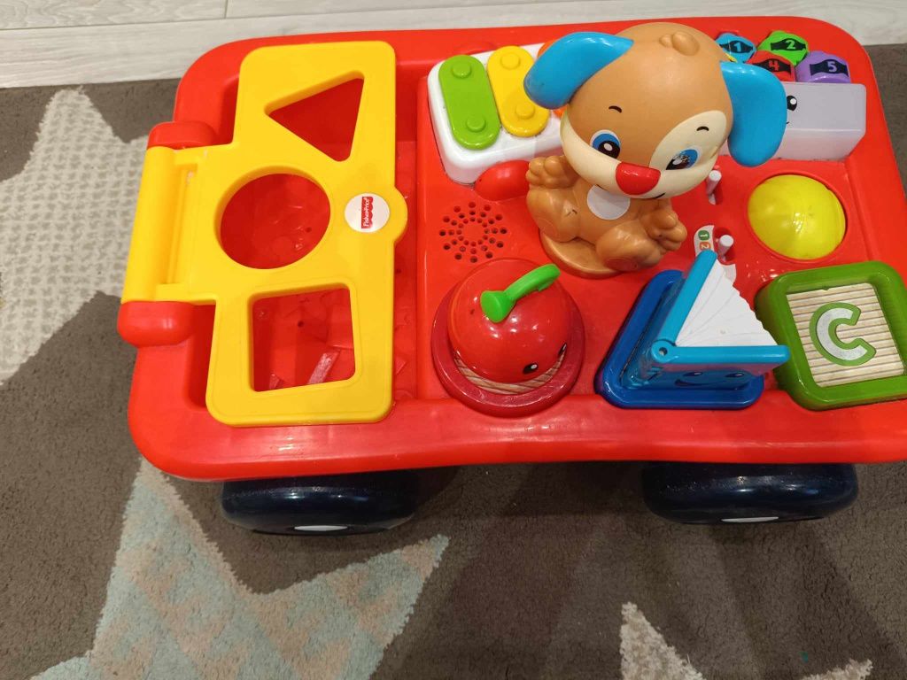 Edukacyjny wózek szczeniaczka Fisher Price 
UŻYWANY Wózek Szczen