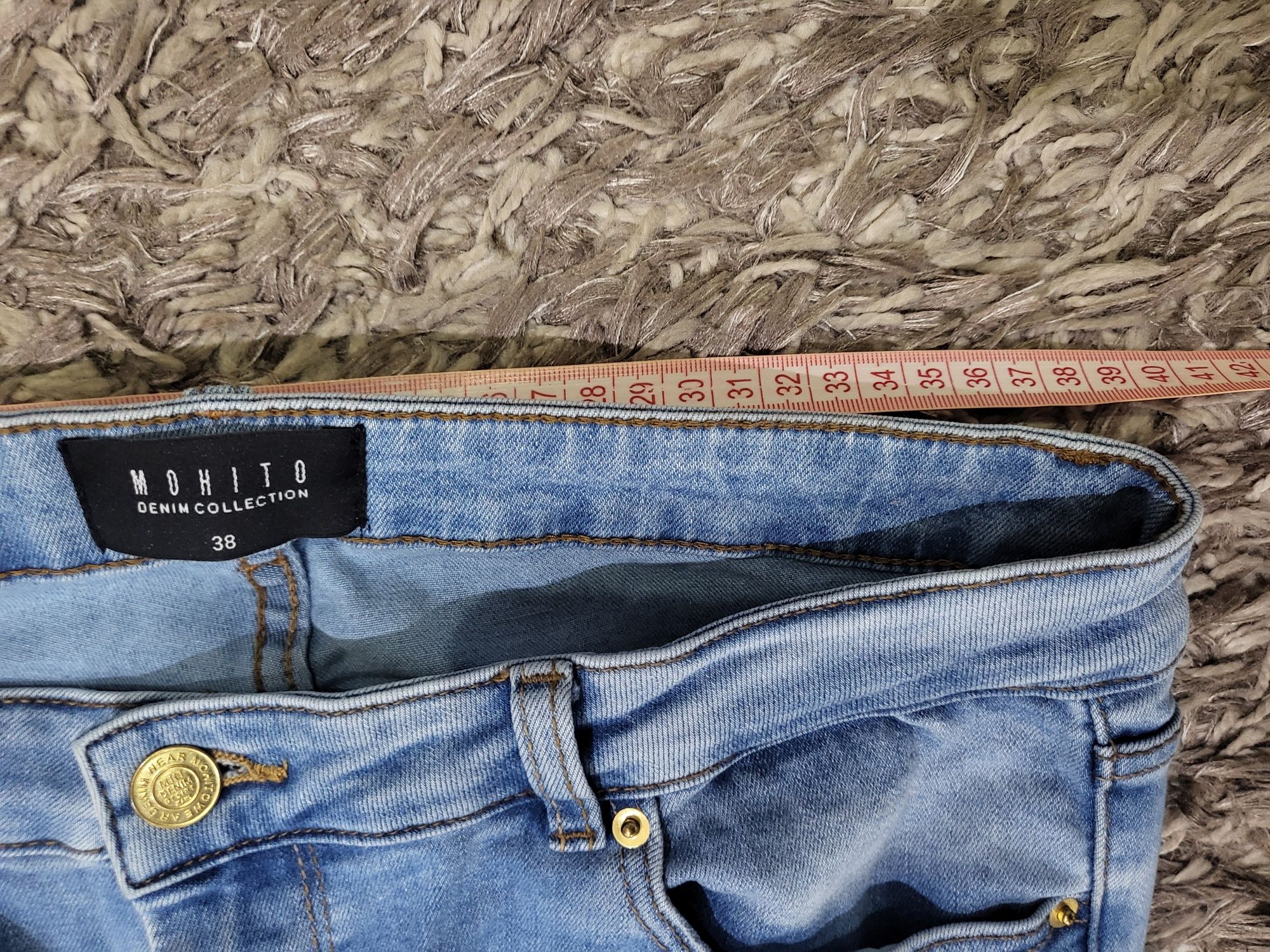 Spodnie damskie jeans niebieskie mohito 38