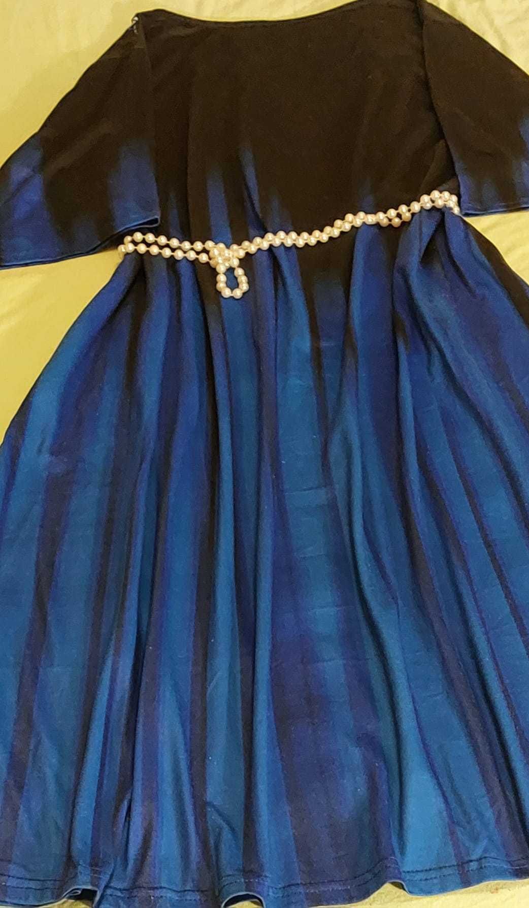 Niebieska zwiewna sukienka dla Pań