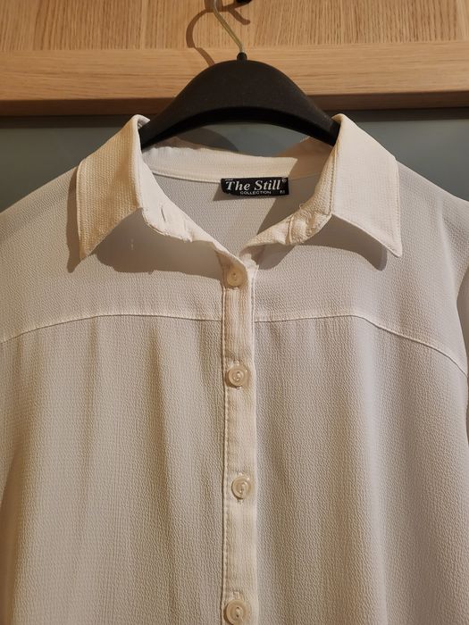 Biała koszula asymetryczna