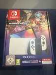 Nintendo Switch OLED plus Mario Kart 8 Deluxe
