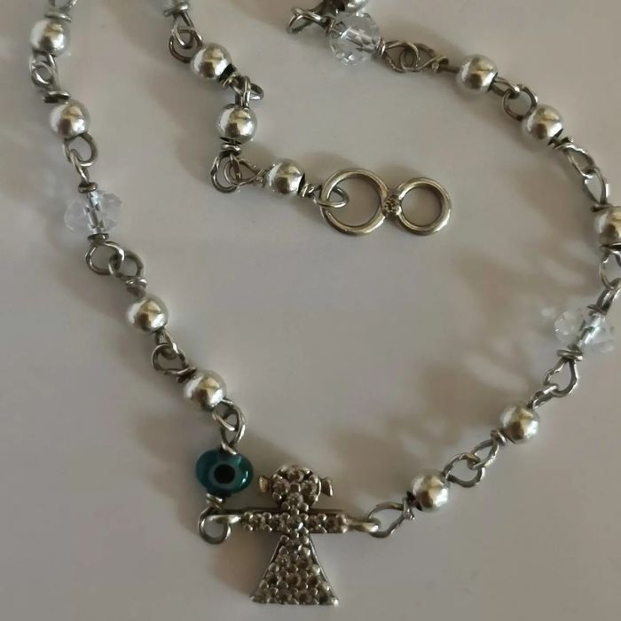 Pulseira em prata menina e olho gordo