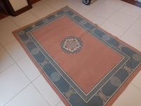 Tapete rosa em bom estado