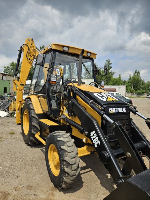 Екскаватор навантажувач Caterpillar C428