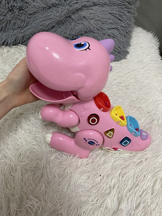 Інтерактивні іграшки: динозаврик, гітара