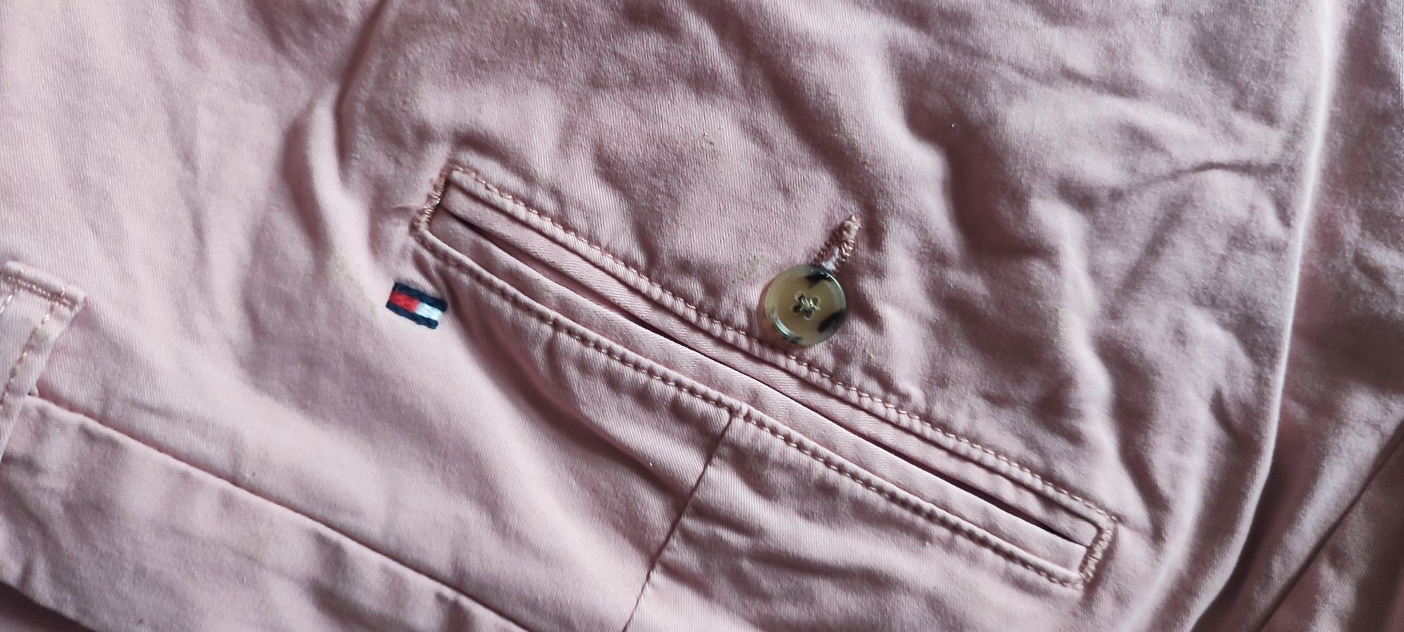 Tommy Hilfiger spodnie męskie chinosy 34/34 jasny róż