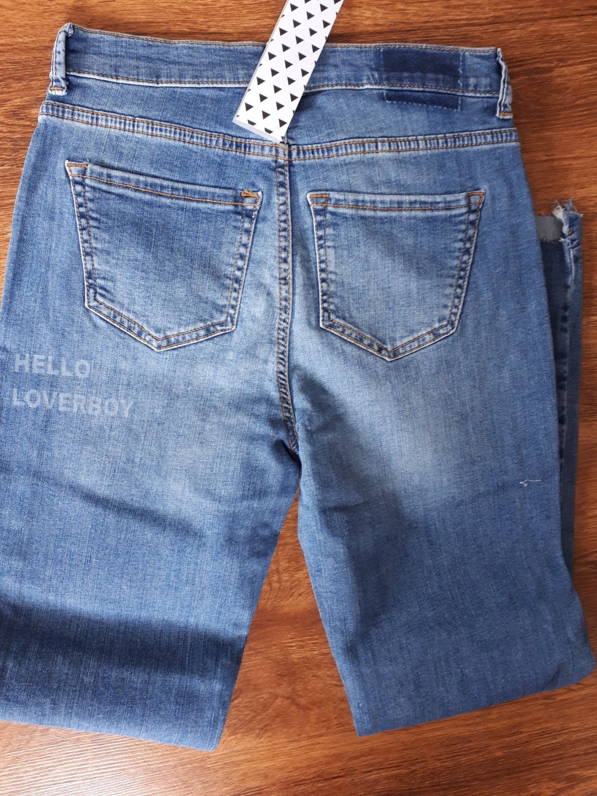 Spodnie damskie jeansowe z przetarciami S 27/32