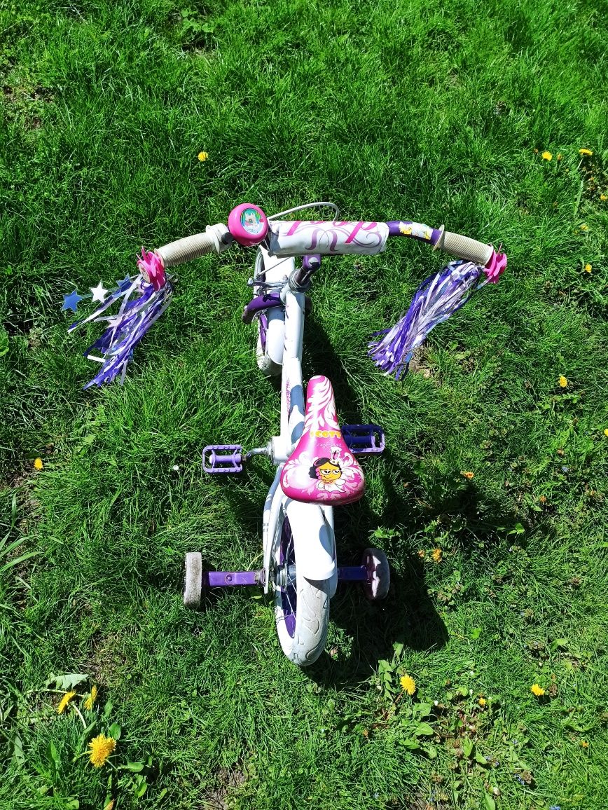 Rowerek dla dziewczynki z bocznymi kołami