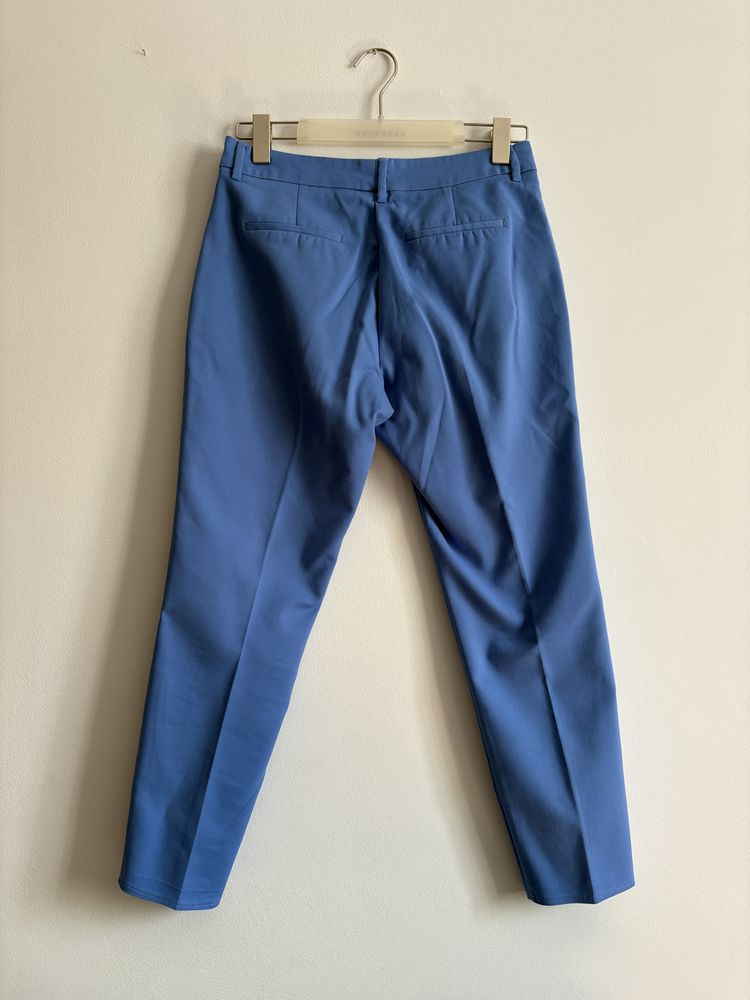 Niebieskie spodnie eleganckie z Reserved