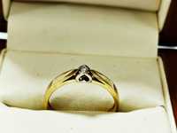Złoty pierścionek z brylantem Briju 1,6g 585