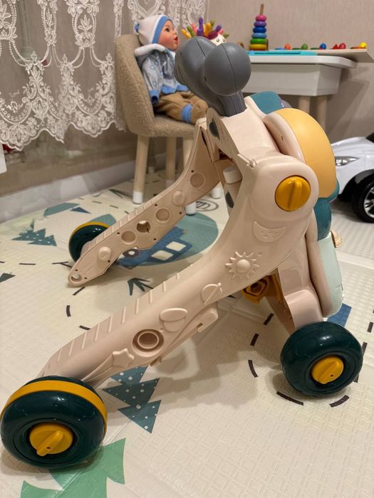 Дитячі розвиваючі ходунки-каталка