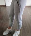 Spodnie dresowe damskie Nike dresy r M/38 srebrne wstawki szary melanż