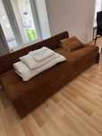 Sofa brązowa jednoosobowa